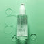 jade hair oil on a green background